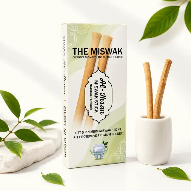 Al-Ihsan miswak carton in soft green and cream, laid flat among sealed miswak sticks and a travel holder