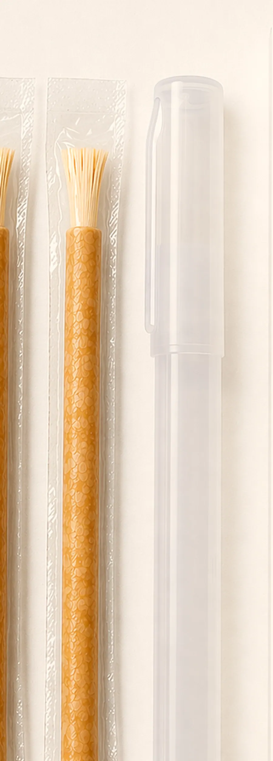 A single vacuum-sealed miswak stick beside its clear protective holder